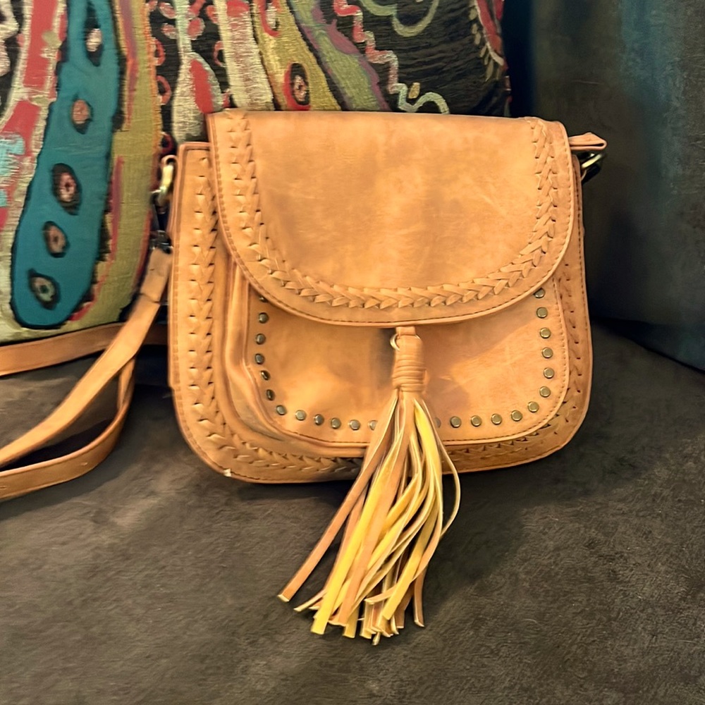 Never used. Classy, western style purse with tassel. Pattern material